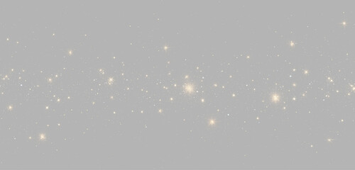 Abstract golden glitter bokeh on gray background, horizontal floating gold particles magic dust trail overlay © Maxim