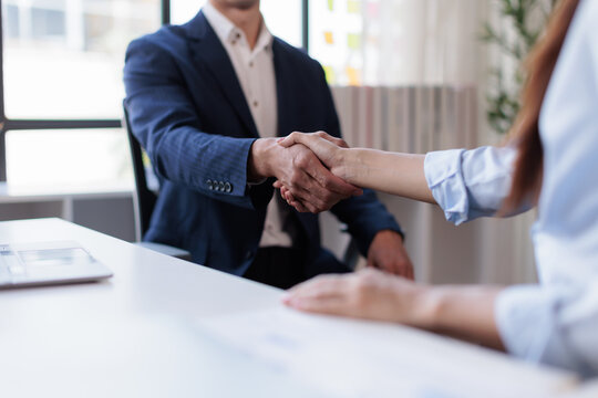 Business handshake for teamwork of business merger and acquisition,successful negotiate,hand shake, businessman shake hand with partner to celebration partnership and business deal concept