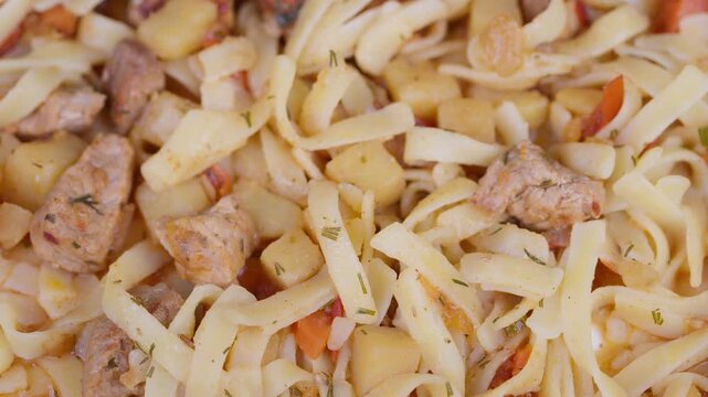 Tasty meat noodles. Hearty stew accompanied by handpulled noodles and tender meat. Delicious bowl of hot noodles served with flavorful stew and fresh herbs for taste