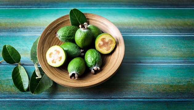 Green Feijoa Fruit Slice Feijoa Leaf Acca Sellowiana In Bowl On Wooden Background Tropical Feijoa Or Pineapple Guava Fruit Exotic Green Fruit Raw Acca Sellowiana Plant Guavasteen Green Fruit