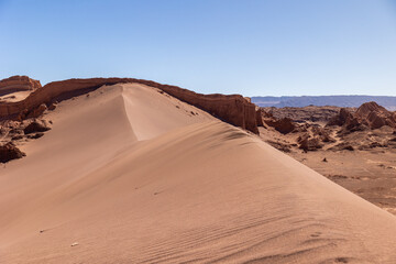 Sand dune ridge in the desert under clear blue sky © Marek