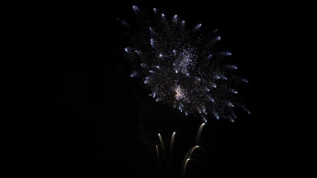 Fireworks exploding during lake night festival celebration