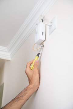  Man checking gas detector device.