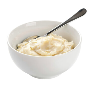 Smooth creamy mashed potatoes served in a plain white ceramic bowl with a silver spoon for a simple side dish or comfort food meal