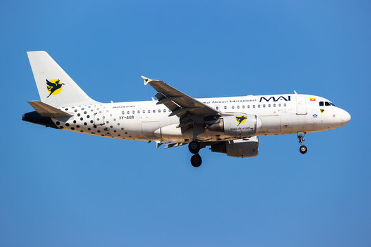 Myanmar Airways International Airbus A319 (XY-AGR) on landing approach at Dubai Airport on November 23, 2025 in Dubai, UAE