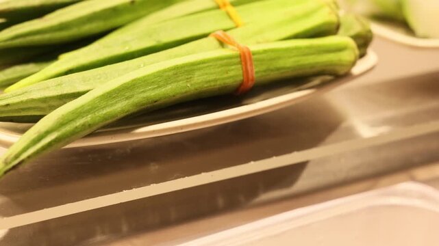 Lady finger vegetable displayed in grocery store food court fresh produce section