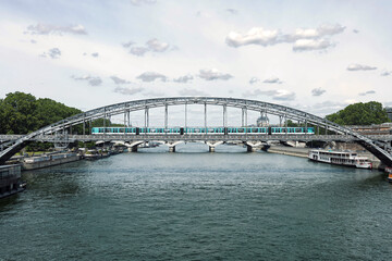 Fototapeta premium Paris Metro train crossing the scenic Viaduc d'Austerlitz over the Seine River