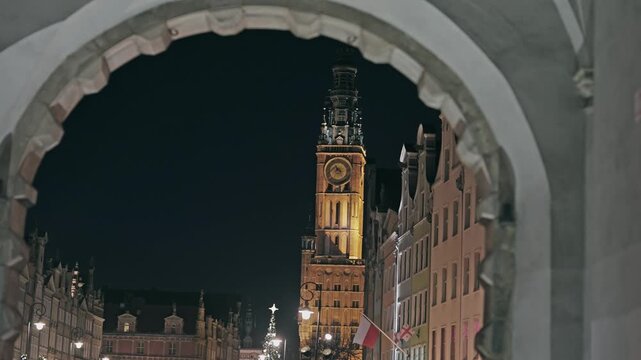 Gdansk Main Town Hall Clock Tower at Night Framed by Arch