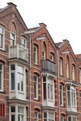 Fototapeta premium Brick House Facades with Ornate Brickwork Decoration in Amsterdam, Oud-West District, Netherlands
