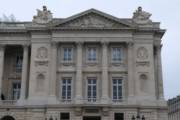 Fototapeta premium Classical/Neoclassical building façades, columns, pediments, Statues, Greco-Roman shapes and design, Ornaments... From this Architectural style inspired by Classical Antiquity. Mostly taken in Paris.
