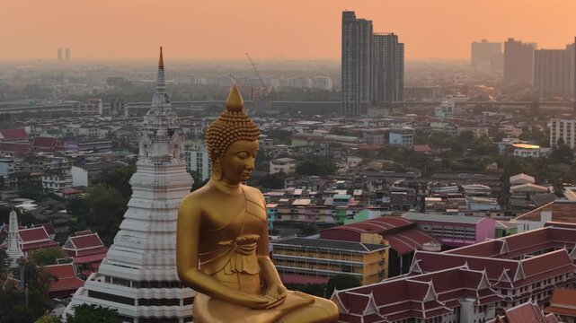 Wat paknam phasi charoen golden buddha statue sunset light aerial view travel in Bangkok Thailand