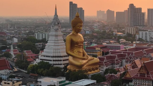 Wat paknam phasi charoen golden buddha statue sunset light aerial view travel in Bangkok Thailand
