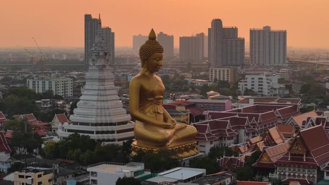 Wat paknam phasi charoen golden buddha statue sunset light aerial view travel in Bangkok Thailand