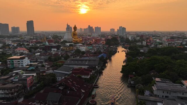 Wat Paknam Phasi Charoenwith river historic  popular site aerial view sunset sky cloud Bangkok city Thailand