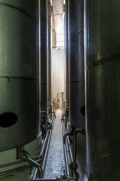 Stainless steel storage tanks inside olive oil factory on Crete