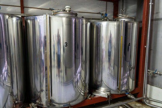 Stainless steel storage tanks inside olive oil factory on Crete