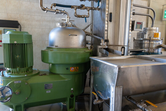 Industrial centrifugal separator and pipes at olive oil plant
