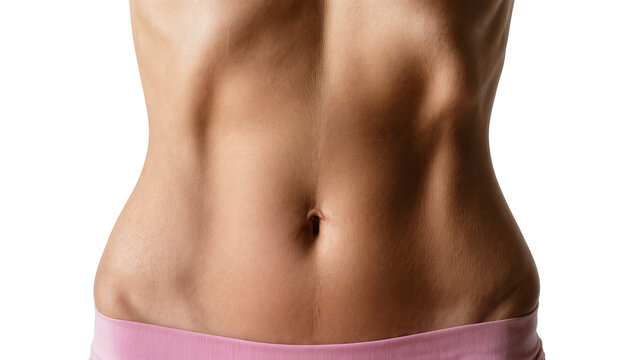 Fit woman s toned abdomen with visible abs and navel