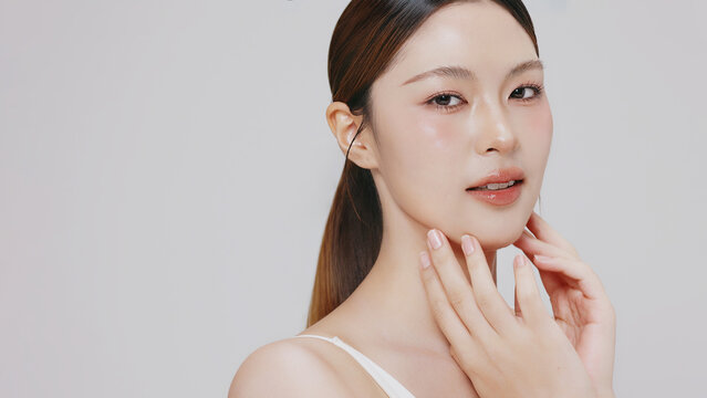 Studio shot of Beautiful young Asian woman with clean fresh skin, Face care, Facial treatment, Cosmetology for commercial advertising.