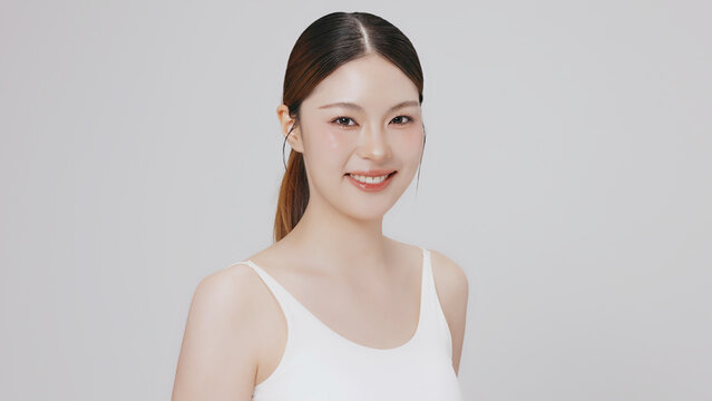 Studio shot of Beautiful young Asian woman with clean fresh skin, Face care, Facial treatment, Cosmetology for commercial advertising.