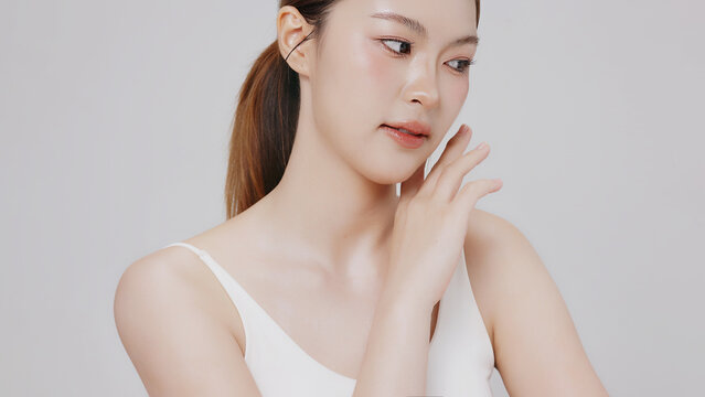 Studio shot of Beautiful young Asian woman with clean fresh skin, Face care, Facial treatment, Cosmetology for commercial advertising.