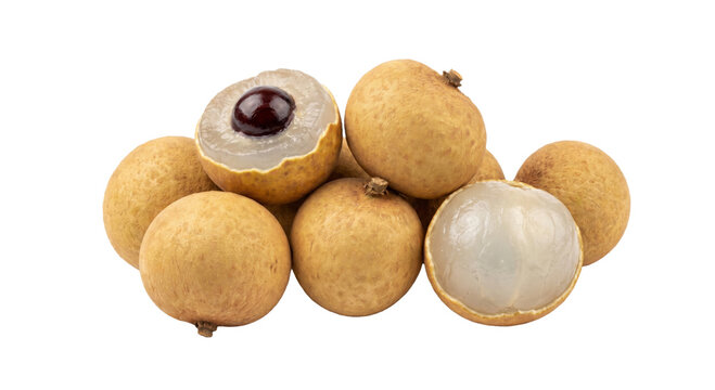 Fresh longan fruits pile, one cut open showing translucent flesh and seed
