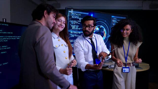 Portrait of confident multicultural technology and business team posing together in modern office environment with digital coding screens and innovation workspace