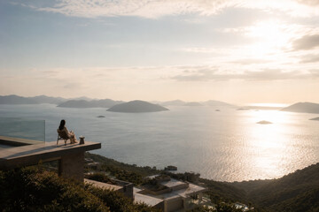 Fototapeta premium Achieving financial freedom while relaxing on luxury terrace by the sea