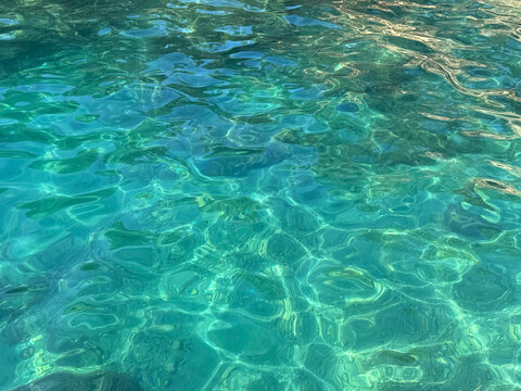 Ocean crystal clear turquoise blue water surface.