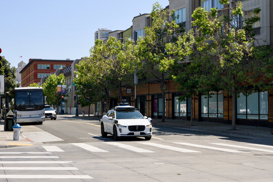 San Francisco California 05 Jun 2026 Waymo electric robotaxi drives past crosswalk