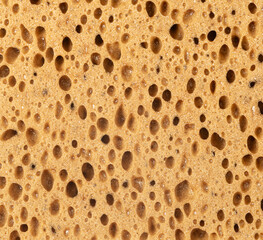 Obraz premium Porous sponge texture showing absorbent surface structure