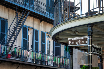 Rue Bourbon and Dumaine crossing, street sign close up, New Orleans French Quarter cityscape, Louisiana © Delphotostock