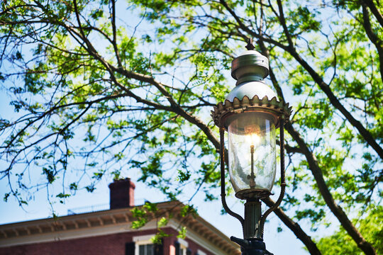vintage, ornate iron street lamp, characteristic of historic city lighting in the Charlestown neighborhood of Boston, Massachusetts, New England
