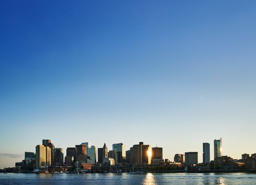 Scenic panoramic view of the Boston skyline and downtown financial district as viewed across the Boston Harbor., Boston, Massachusetts, New England, United States