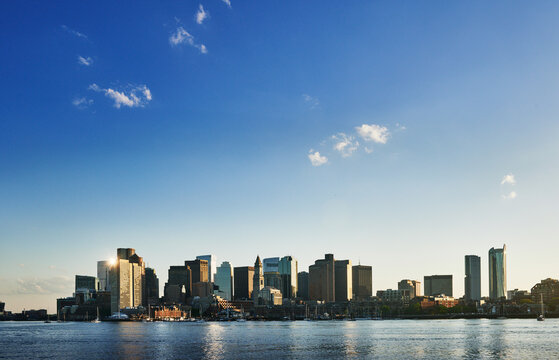 Scenic panoramic view of the Boston skyline and downtown financial district as viewed across the Boston Harbor., Boston, Massachusetts, New England, United States