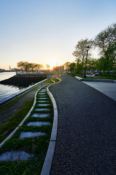 Walking path through LoPresti Park at sunset, a four-acre waterfront location in Boston, Massachusetts, New England, United States 