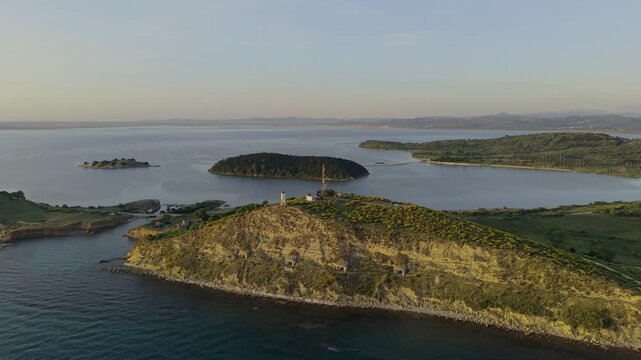 Aerial view of the Vjose-Narte Delta Protected Area featuring the Zvernec islands and coastal bunkers under a clear sky in Zvernec, Vlore County, Albania.