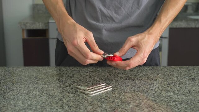 Close up man placing hex key set on table one by one with clear sound. Hands organizing Allen keys. Tool arrangement, workshop routine, precision and ASMR concept.