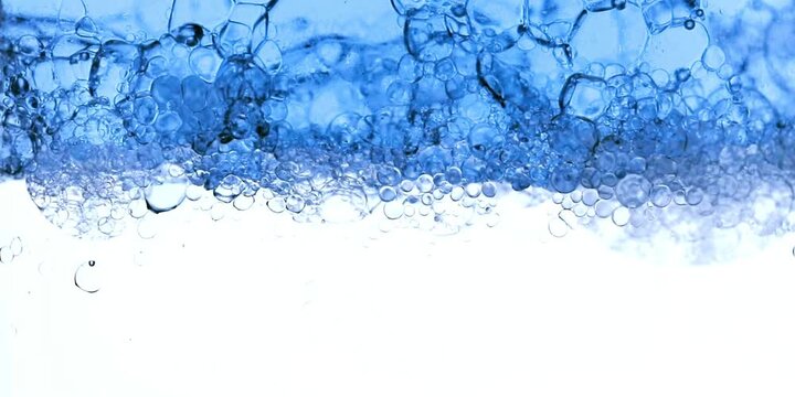 Water Bubbles Rise in Ocean Surface with Clear Blue and White Space