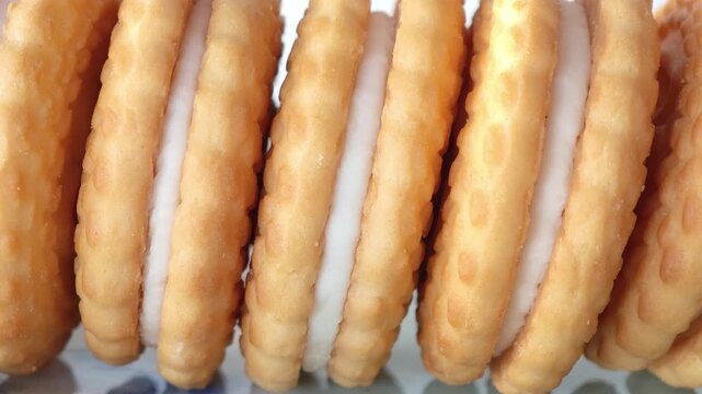 Cream-filled crackers on a plate.