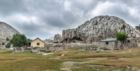 Panoramic view of a remote mountain settlement and green pastures in High Taseli region of the Taurus Mountains © Ali Kemal