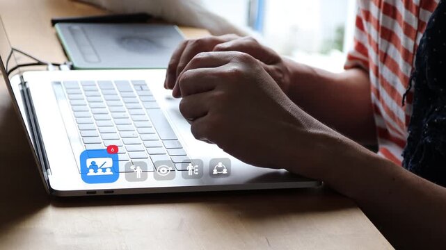 Close up of an Asian man typing on a laptop, with 3D tracked digital classroom icons, target arrows, and business networking notification graphics.
