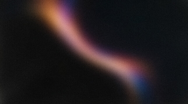 A vibrant colorful light streak swirls across a dark mysterious background