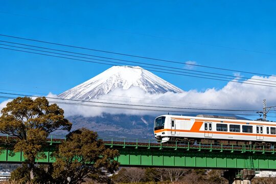 Train Crossing Bridge with Mount Fuji in Background
