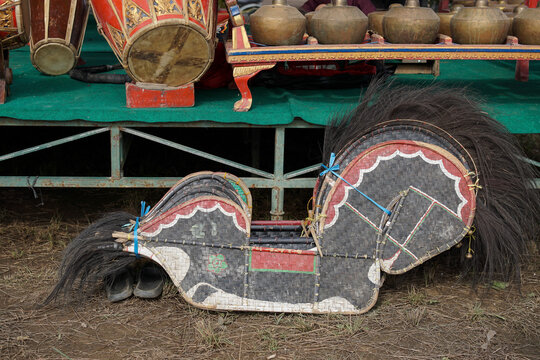 Traditional Indonesian Kuda Lumping woven bamboo horse puppet with gamelan instruments, representing Javanese folk culture and cultural heritage