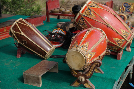 Traditional Indonesian kendang drum with an ornate carved wooden body, representing gamelan music, Javanese culture, and cultural heritage