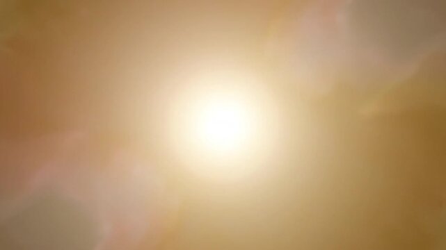 Bright central spotlight flare on smooth warm tan gradient background