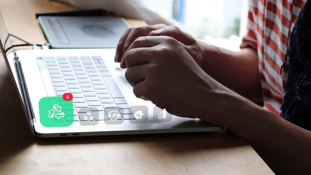 Asian worker using laptop at home office desk, featuring 3D tracked green recycling loop badge, trash disposal icons, and eco house notifications.