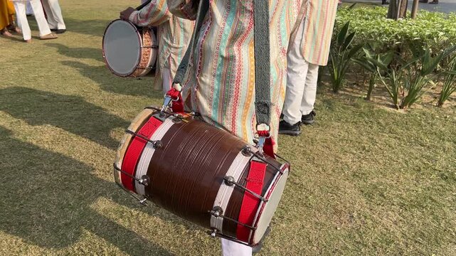 Dhol Playing in Function with Traditional Indian Drum Performance, Wedding Celebration, Festive Energy, and Cultural Music Atmosphere