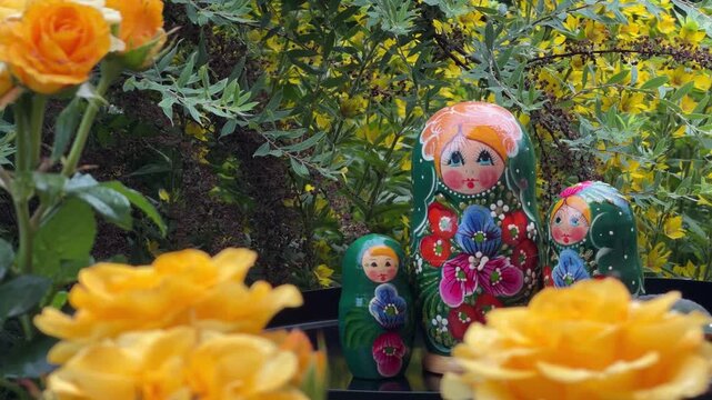 Matryoshka Dolls with Yellow Roses: Traditional Russian nesting dolls, known as Matryoshka dolls, are displayed alongside vibrant yellow roses, creating a charming and colorful composition.